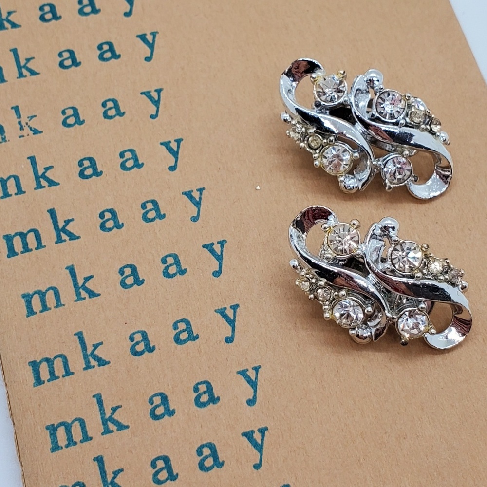 Vintage silver tone clear rhinestone clip ons retro black tie runway showgirl